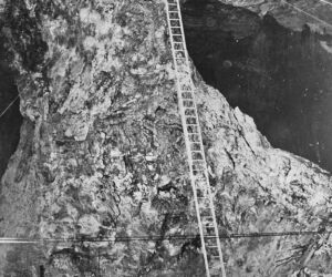 In the old days, rope riders held the ladder while others armed with drills climbed to the ceiling of the void. When it was time to move on to another site, the rope riders swung the ladder to a new position.