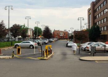 The doctor is walking toward "ballpark alley" where the left field bleachers once stood.