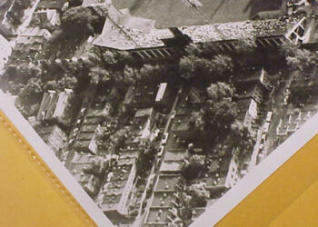 In this later photograph, the houses behind the Fifth Street fence are visible. The house closest to the corner of Fifth and Oakdale has a white roof.