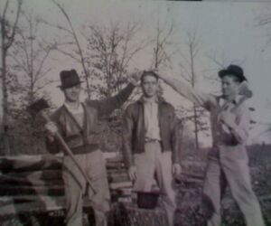 Mining bred fatalism and mordant humor. Mutt's friends, Jay Hemphill (left) and Ed VonMoss (right) pretend to prepare him for a guillotine.