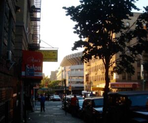 Looking west from the corner of 158th St. and Walton Avenue. The upper deck of the Stadium looms in the distance.